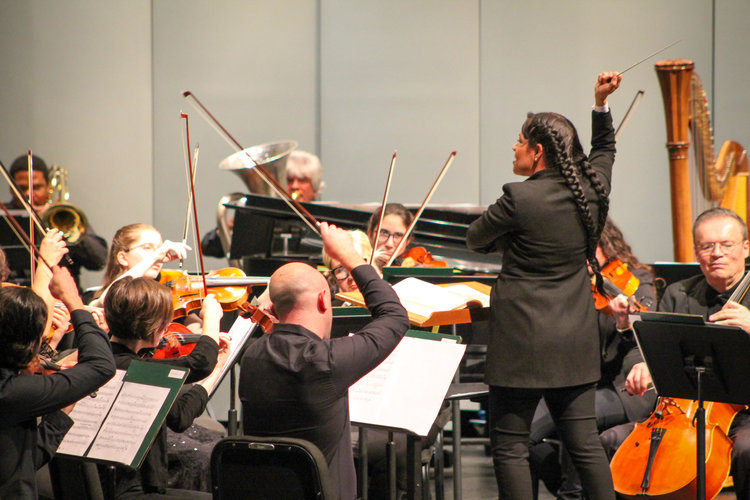 Conductor, Paula Nava Madrigal, leads the Orchestra.
