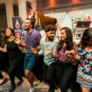 Audience members dance in the aisles during our Global Rhythms show with Aynur last April