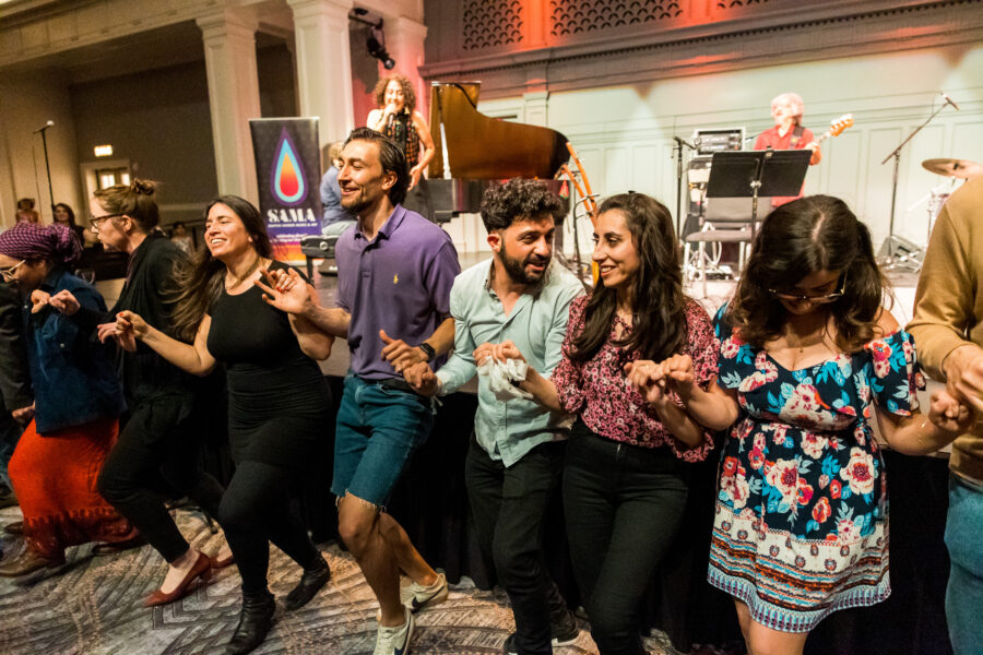 Audience members dance in the aisles during our Global Rhythms show with Aynur last April