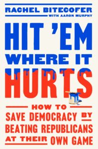 Book cover: A white background with the title ""Hit 'Em Where it Hurts" in red with blue paint dripping from the top. A blue can of paint is in front of the title. Subtitle below says "How to Save Democracy by Beating Republicans at Their Own Game."