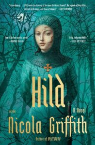 Book cover of "Hild: A Novel" by Nicola Griffith. The cover features a medieval person wearing chainmail and a headpiece, set against a backdrop of a dark forest. The title "Hild" is prominent in large text at the center. The author's name is at the bottom in bold white font.