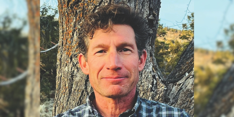 Headshot of Auden Schendler (with fair skin, short brown hair, and plaid button-down shirt)