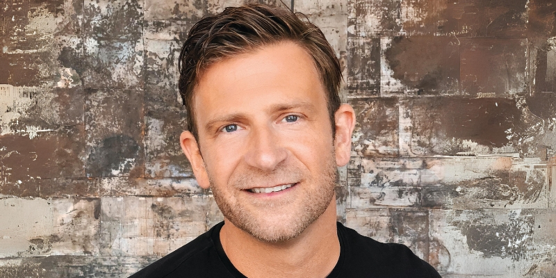 Headshot of Chase Jarvis (with short brown hair, light skin, and black tee shirt)