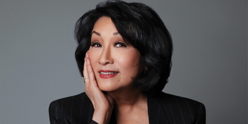 Headshot of Connie Chung (with light skin, black bob haircut, and black blazer jacket)