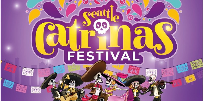 Seattle Catrinas Festival banner with yellow/purple skull-themed logo and skeleton mariachi band performing under papel picado decorations.