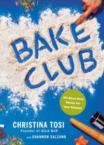 Book cover of Bake Club by Christina Tosi and Shannon Salzano, featuring the title written in flour on a blue background with a finger tracing the letters. Sprinkles, pretzels, and baking tools are scattered around. A green circle with text says "101 Must-Have Moves for Your Kitchen" in the bottom right corner.