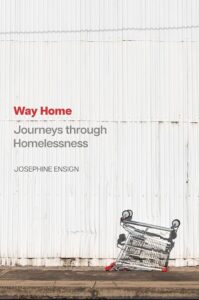 Book cover of 'Way Home: Journeys through Homelessness' by Josephine Ensign, featuring an upside-down shopping cart on the sidewalk in front of a white corrugated metal wall.