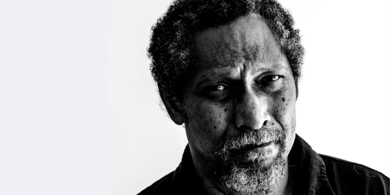 Black and white headshot of Percival Everett (with short textured hair and beard)