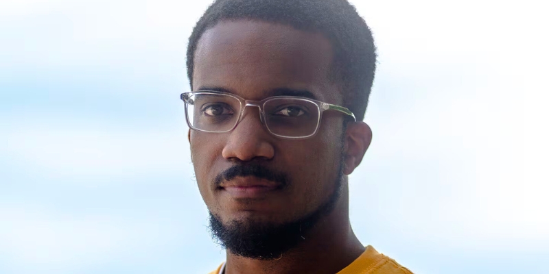 Headshot of Victor Luckerson (with dark skin, buzzed black curly hair/beard, and eyeglasses)