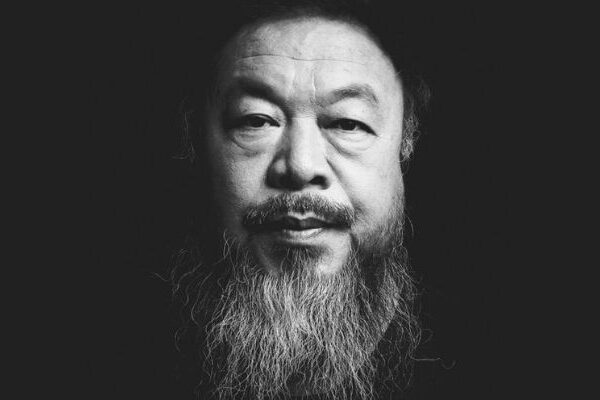 Black and white photos of artist Ai WeiWei with a long greying beard and shaved head.