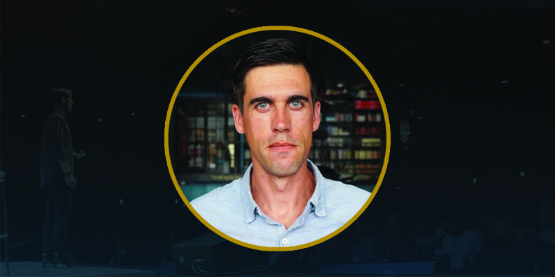 Banner graphic featuring a headshot of Ryan Holiday (with short brown hair and blue button-up)