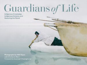 Book cover for "Guardians of Life: Indigenous Knowledge, Indigenous Science, and Restoring the Planet," featuring an image of a person wearing a winter jacket, paddling on an ice floe. The view is partially covered by the front of a boat.