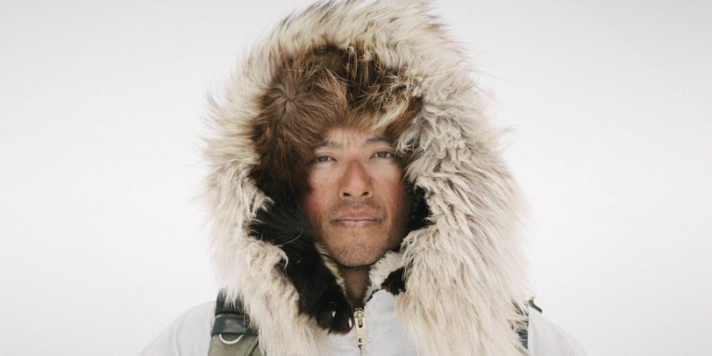 Headshot of Kiliii Yuyan (wearing a white hooded jacket with a fur lining)