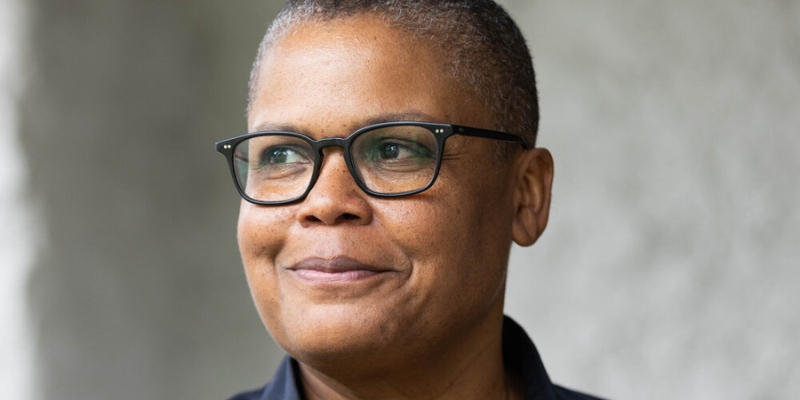 Headshot of Keeanga-Yamahtta Taylor (with brown skin, eyeglasses, and shaved black/grey hair)