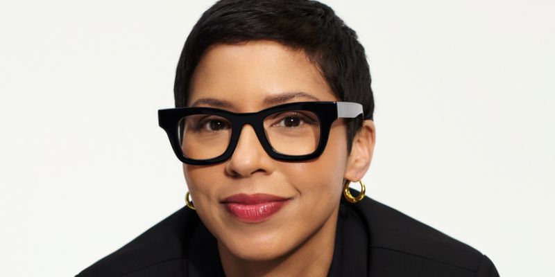 Headshot of Melissa Murray (with tan skin, short black hair, and black eyeglasses)