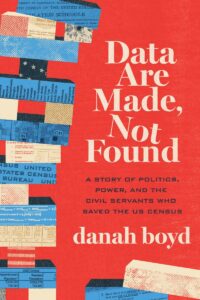 Book cover of "Data Are Made, Not Found: A Story of Politics, Power, and the Civil Servants Who Saved the US Census" by danah boyd, featuring a red background and layered books covered in papers related to the U.S. Census.